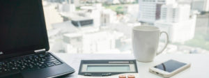 women accountant using calculator in office